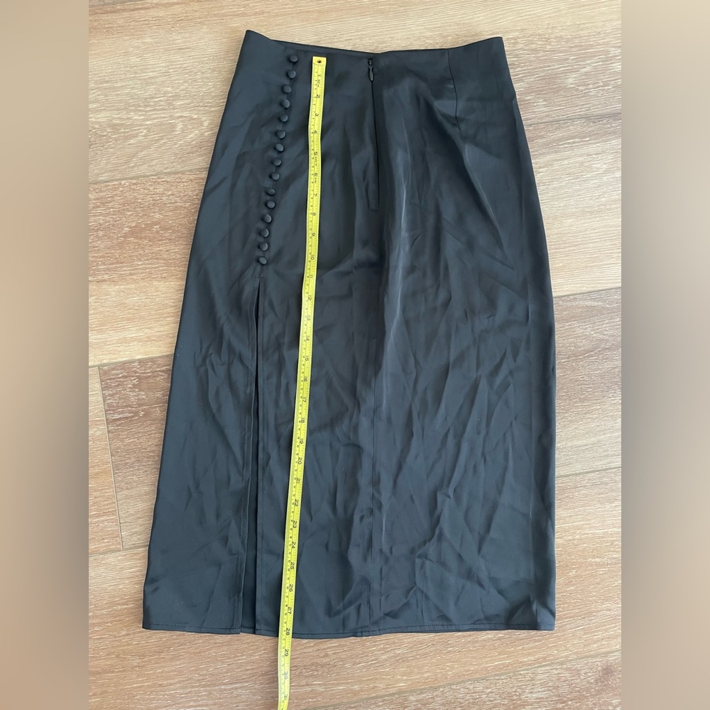 Super cute slip skirt slit in the back.
